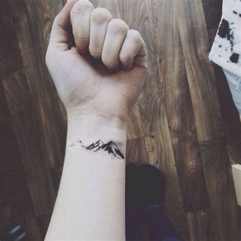 Lovely Hand Mountains Tattoo Tattoomagz › Tattoo Designs Ink