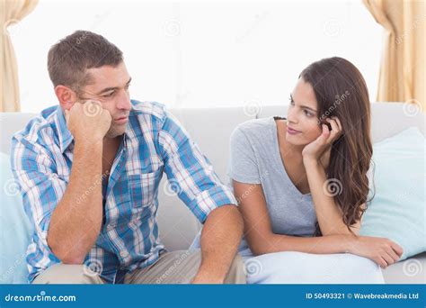 couple discussing on sofa stock image image of quarter 50493321
