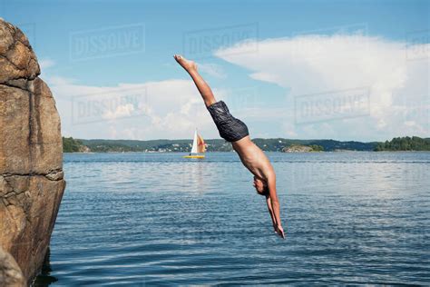 Man Jumping Into Sea Stock Photo Dissolve