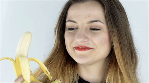 Woman Eating Banana Isolated Steadycam Stock Footage Sbv