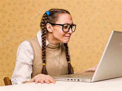 Young Female Nerd Sitting On The Computer — Stock Photo © Nesharm 61112543