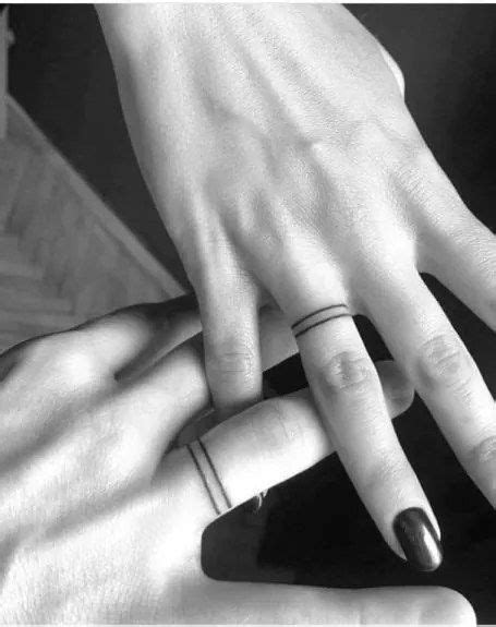 27 Charming Wedding Ring Tattoos To Try With Your Partner Engagement Tattoos Couples Ring