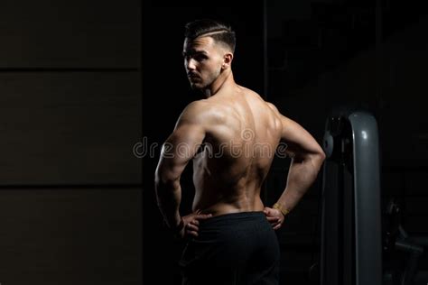 Muscular Man Flexing Back Muscles Pose Stock Image Image Of Equipment