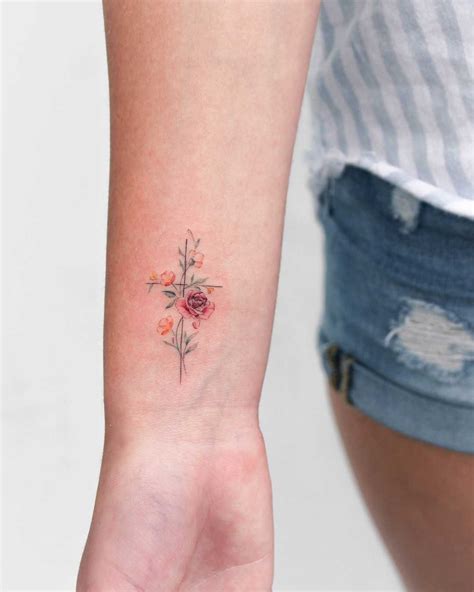 Floral Cross Tattoo By Iris Art Inked On The Right Wrist Beautiful