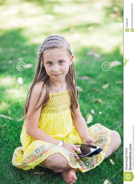 Cute Little Girl Learning With Tablet Pc Stock Photo
