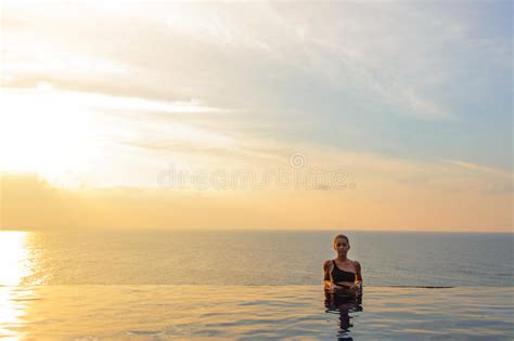 Woman At The Infinity Pool On Sunset Stock Image Image Of Blue Pose