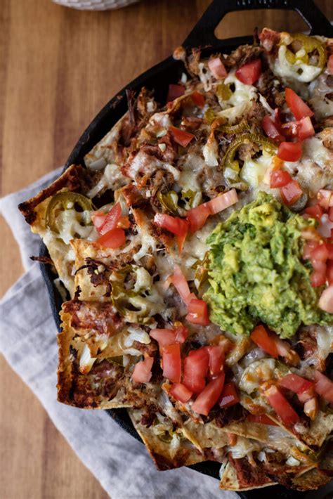 Top each taco with cilantro, finely chopped onion and salsa. Piled High Carnitas Nachos - Modern Crumb