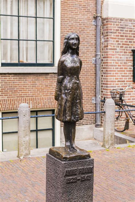 Statue Of Anne Frank Outside Westerkerk Amsterdam Netherlands Europe