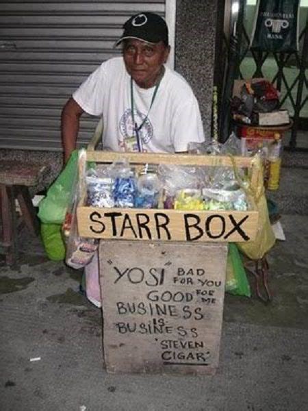 A Man Sitting In Front Of A Star Box