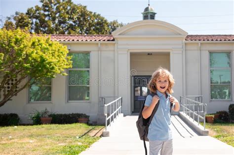 Back To School Cute Kid With Backpack Running And Going To School