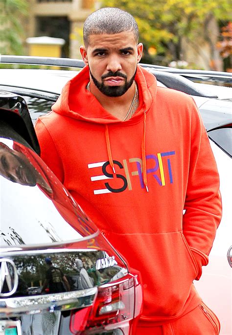 Drake Turns Heads In Orange Esprit Sweatsuit Street Style Pics