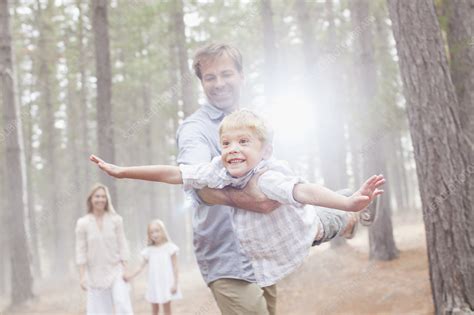 Father Flying Son In Sunny Woods Stock Image F0134826 Science