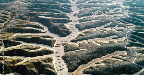 Dryland Farming In Aerial View With Windmills In The Middle Of The