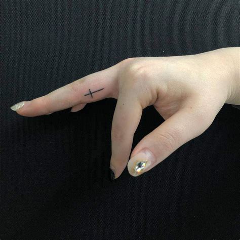 Cross Finger Tattoo Ideas Photos