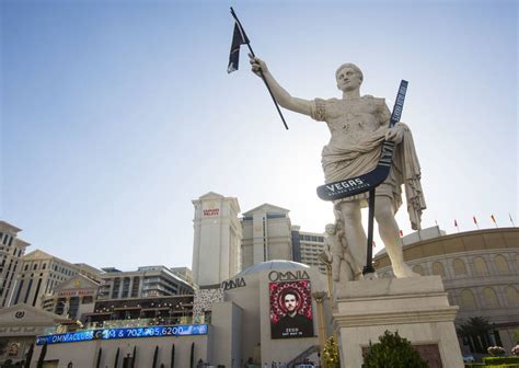 Caesars Palace Statue Now Holds Golden Knights Hockey Stick — Photos