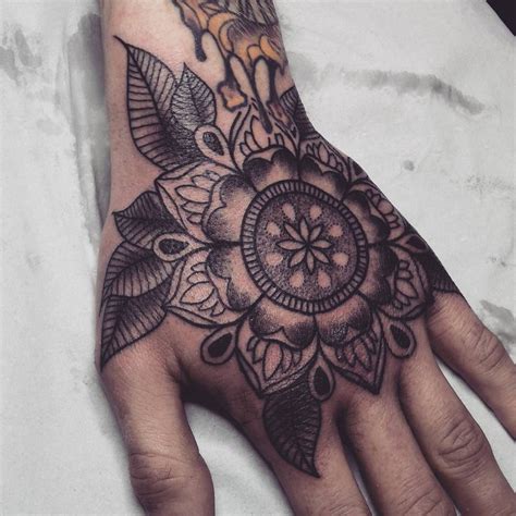 A Person S Hand With A Tattoo On It