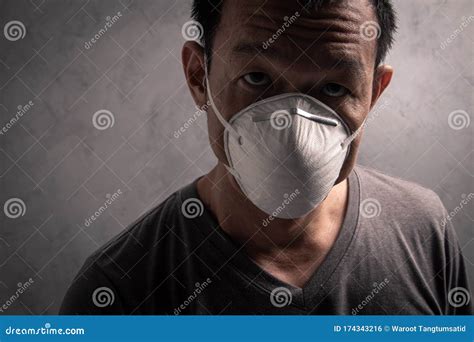 Asian Man Wearing N95 Mask To Prevent Flu Virus And Pm25 Dust Air