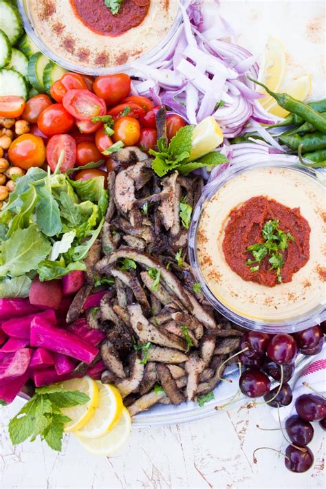 It can be served on a plate with accompaniments or in a sandwich or wrap, which is more common. Grilled Lamb Shawarma Platter Recipe • Two Purple Figs