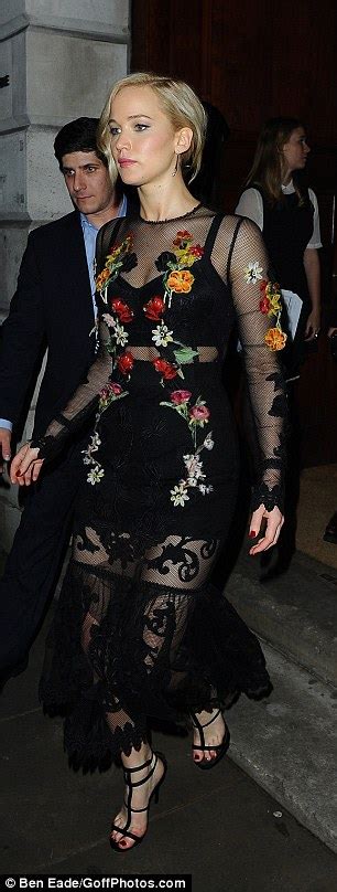 Jennifer Lawrence Flashes Her Black Bralet In Sheer Dress In London