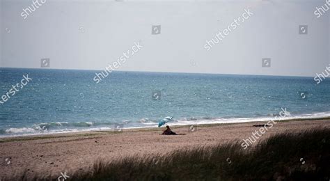 Sole Person Sits On Beach Near Editorial Stock Photo Stock Image