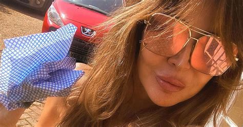Lizzie Cundy Sees Cleavage Spill From Swimsuit Slashed To Navel For Cleaning Session Daily Star