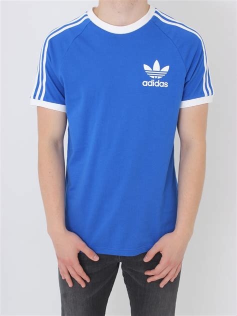 Originals is anchored by iconic looks, like the superstar, and high profile collaborations with the likes of pharrell williams and kanye west. adidas Originals CLFN T Shirt in Blue - Northern Threads