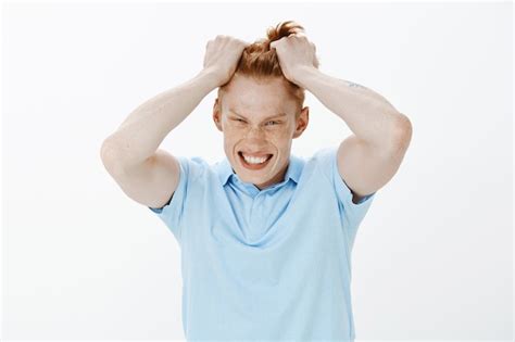Free Photo Close Up Of Outraged Angry Redhead Man Ripping Hair Out Of