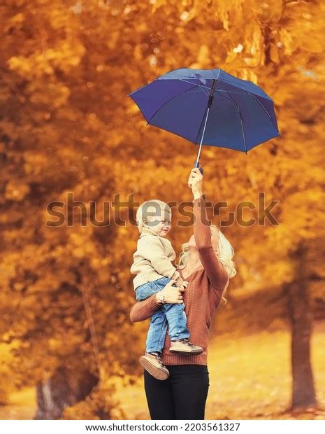 Happy Smiling Mother Holding Child Umbrella Stock Photo 2203561327