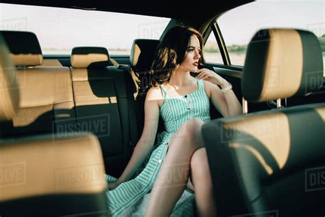 Caucasian Woman Sitting In Back Seat Of Car Stock Photo Dissolve