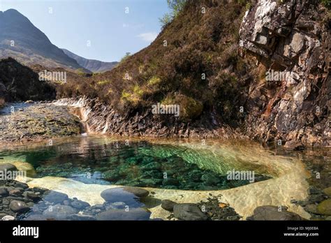 Rock Pool Eroded Into Skye White Marble Slab In Mountain Stream Bed Of