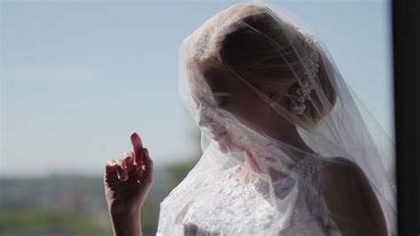 Beautiful Bride In Veil Posing Near Window Stock Footage Sbv