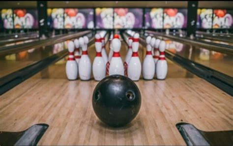 Premium Ai Image Bowling Pins Lined Up With A Ball In Front