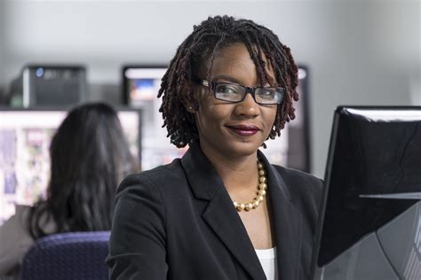 Young Black Professional Woman Working On Computer At The Office