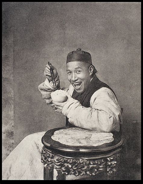 A Smiling Man Eating Rice In A Photographers Studio Historical
