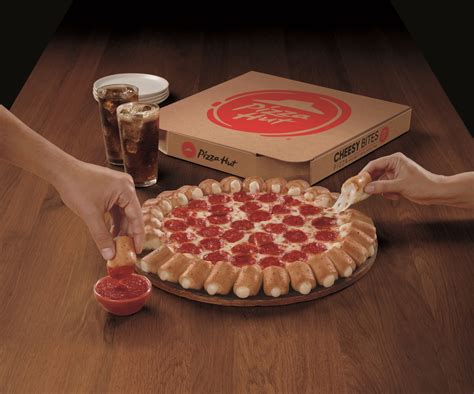 The cheesy bites pizza is the spiritual descendant of the stuffed crust pizza. Cheesy Bites Pizza Is Back At Pizza Hut - Simplemost