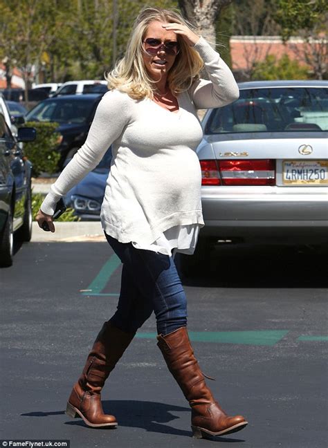 pregnant kendra wilkinson swaps her gym gear for stylish sweater and boots as she heads out for
