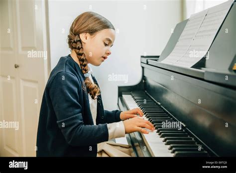Mixed Race Girl Playing Piano Stock Photo Alamy
