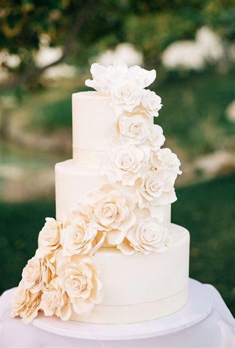 Simply Elegant Off White Three Tier Wedding Cake Wrapped With Sugar Flowers Featured Photograph