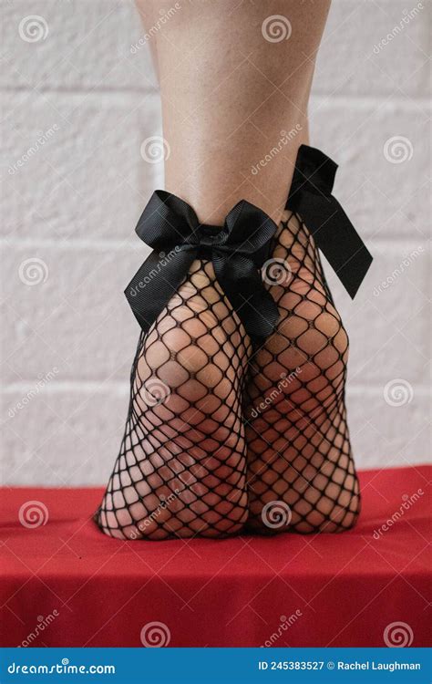 Feet With Fishnet Socks And Black Bows Stock Image Image Of Pantyhose
