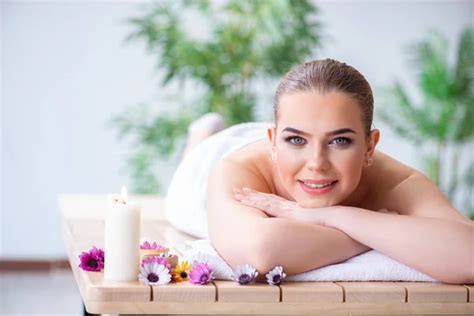 woman during massage session in spa stock image everypixel