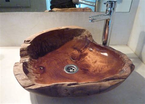 It features two metal sinks and a practical construction with six shelves and lower compartments with double wooden doors and. wooden basin - Google Search | Banheiro de madeira ...