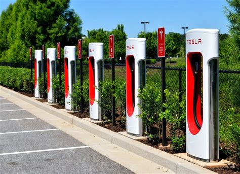 A Row Of Red And White Electric Charging Stations