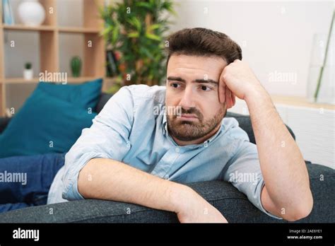 Sad Man Portrait At Home Feeling Depressed Stock Photo Alamy