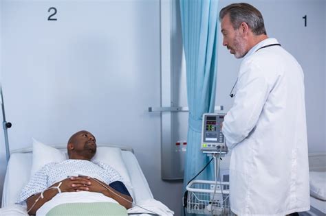 Premium Photo Doctor Interacting With Patient During Visit In Ward