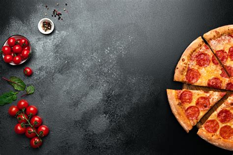 Pepperoni Pizza On Black Slate Background Stock Photo Download Image