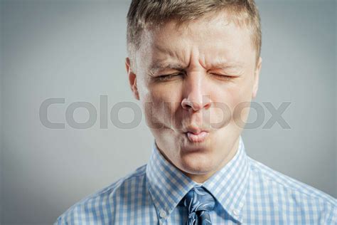 Man Sucking In His Cheeks Stock Image Colourbox