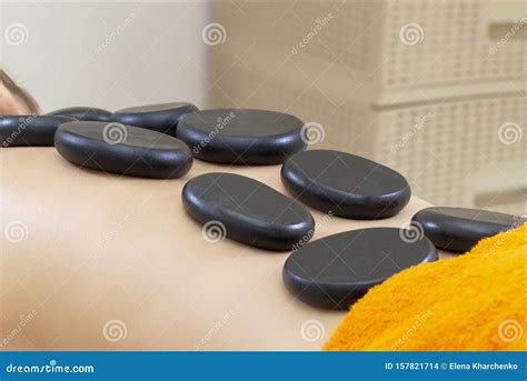Spa Hot Stone Massage Stone Treatment Woman Getting A Hot Stone Massage At A Day Spa Stock