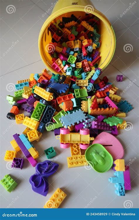 A Bucket Of Scattered Legos On The Floor Stock Image Image Of Puzzle