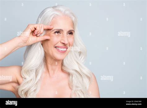 Close Up Portrait Of Attractive Cheery Grey Haired Elderly Lady Showing