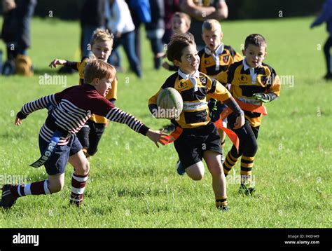 Happy Smiling Boy Playing Junior Childrens Tag Rugby Match Action